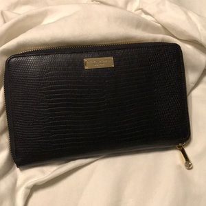 Henri Bendel large zip around wallet.